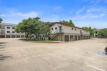 An empty parking lot in front of a building
